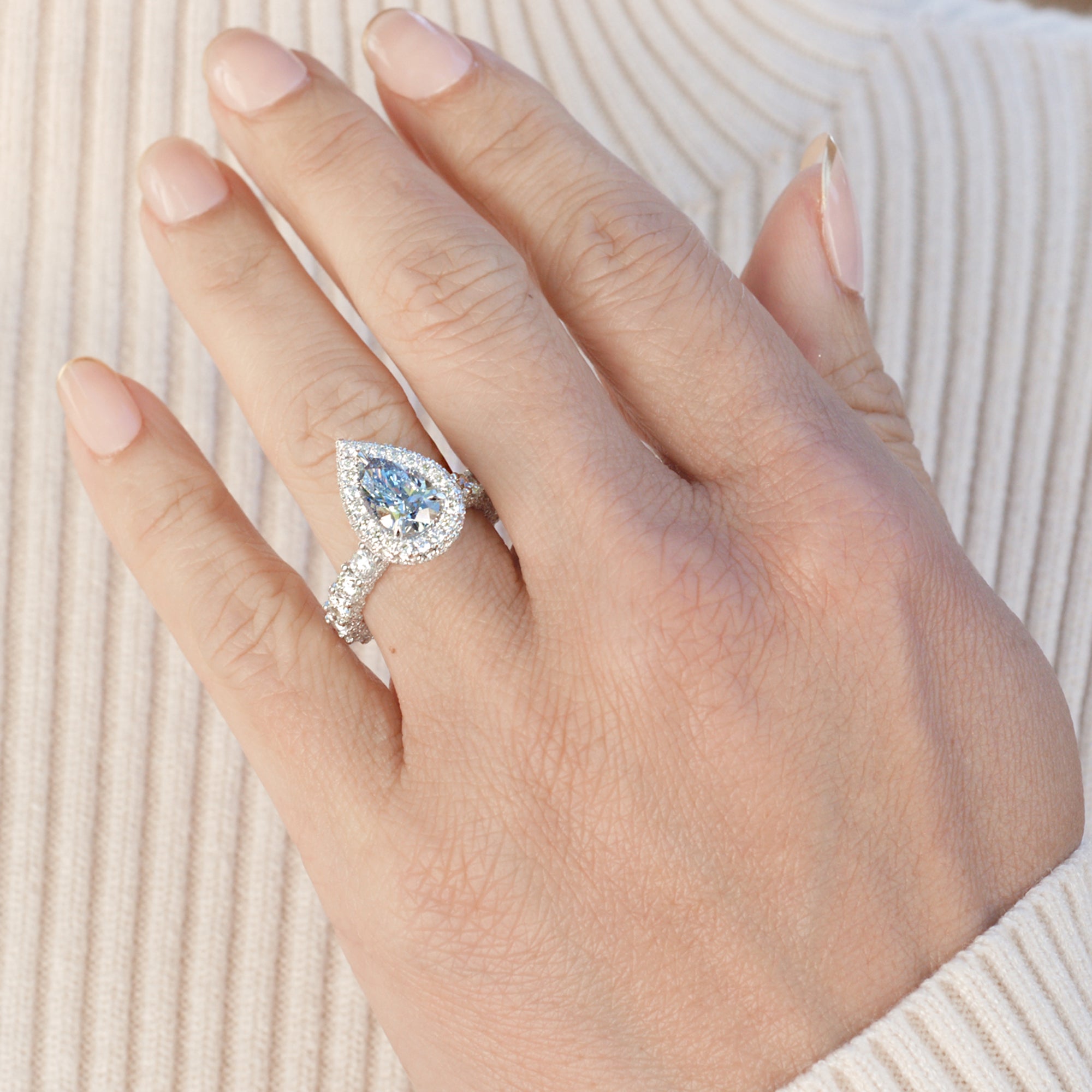 pear blue diamond engagement ring in white gold