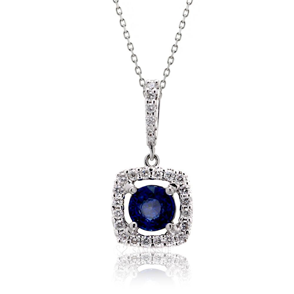 Medium blue sapphire diamond halo pendant in white gold