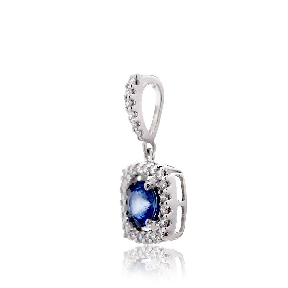 Medium blue sapphire diamond halo pendant in white gold