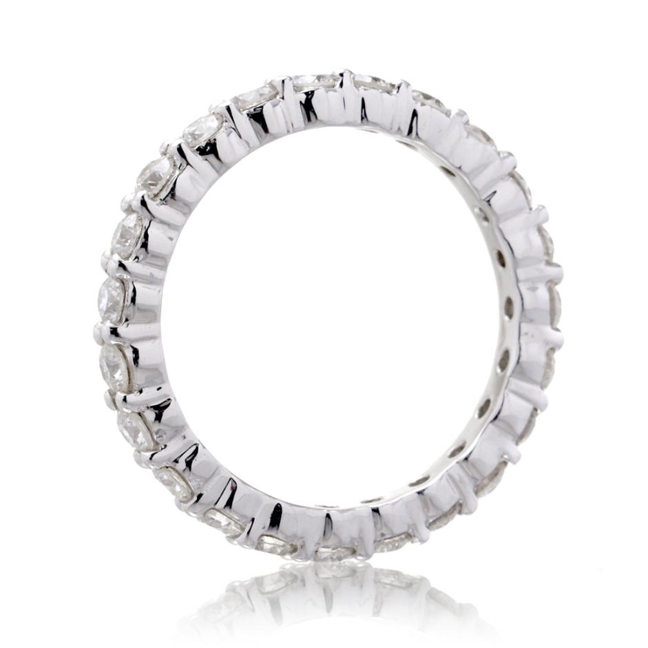 Eternity diamond band with double shared prongs in white gold
