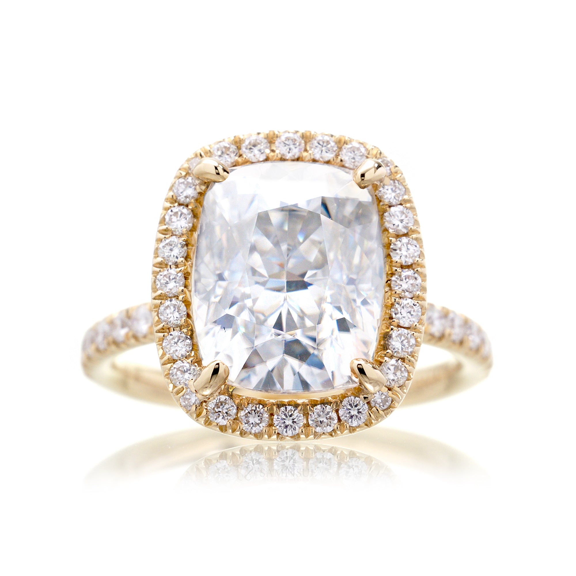 Cushion moissanite and diamond halo ring with a diamond band in yellow gold - the drenched