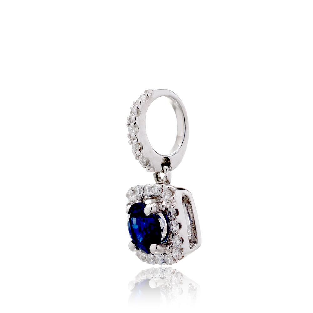 Petite blue sapphire diamond halo pendant in white gold side view