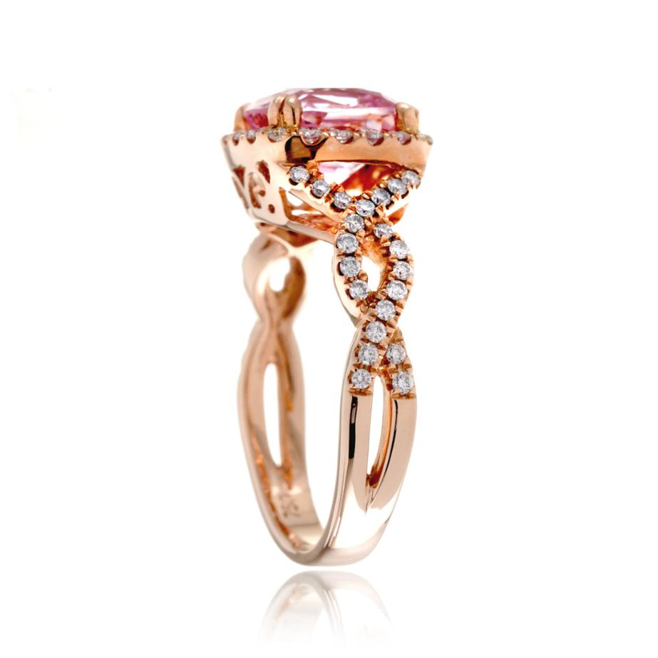 Cushion lab-grown pink sapphire with natural diamond halo and twist shank rose gold ring