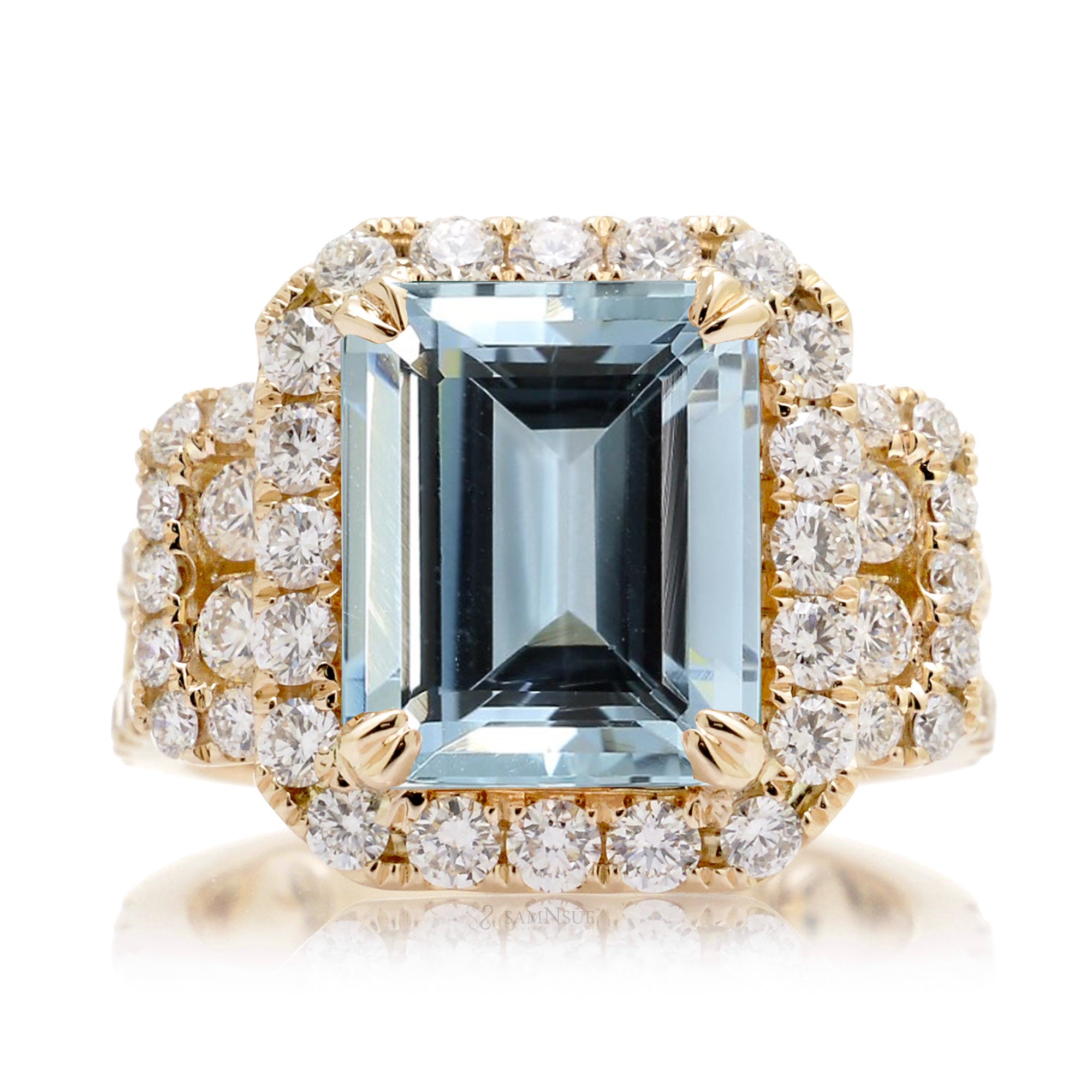 Emerald cut aquamarine with diamond halo and three stone bold wide setting engagement anniversary ring in yellow gold