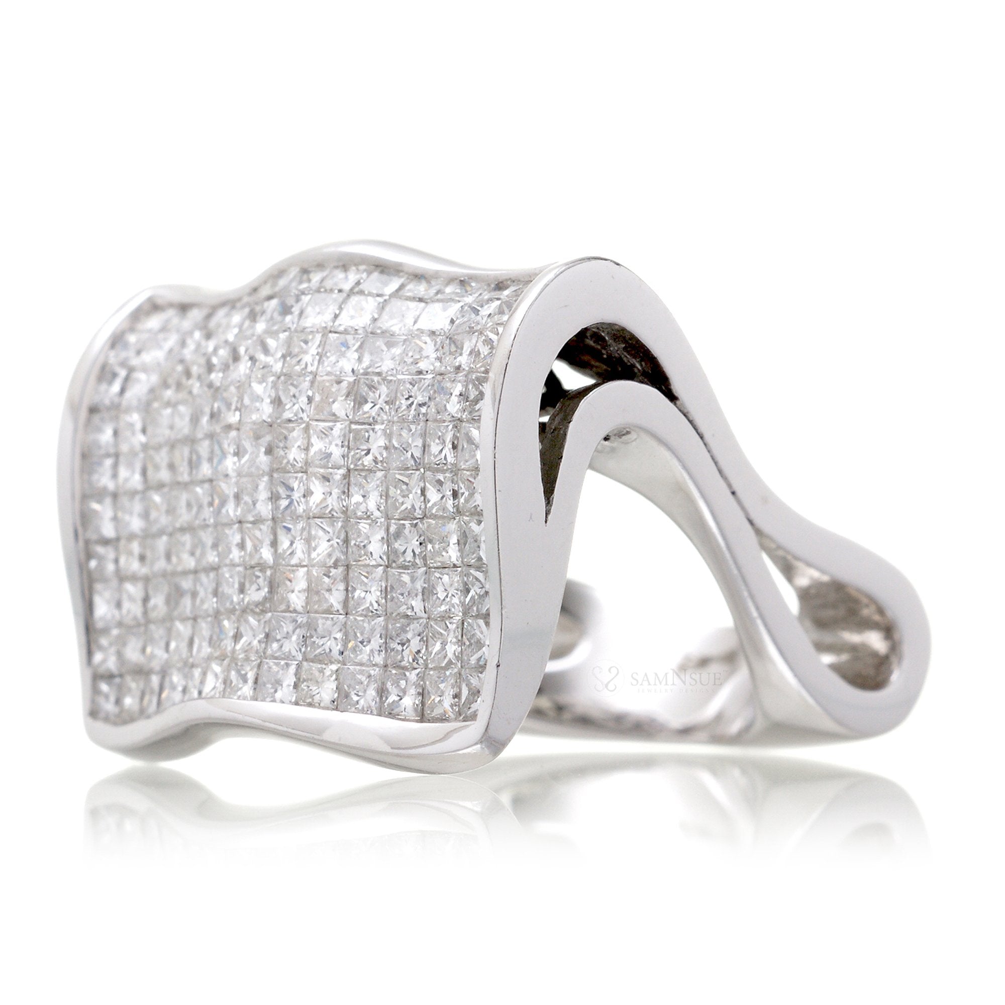 Unique diamond band with princess cut diamonds in a floating invisible setting white gold