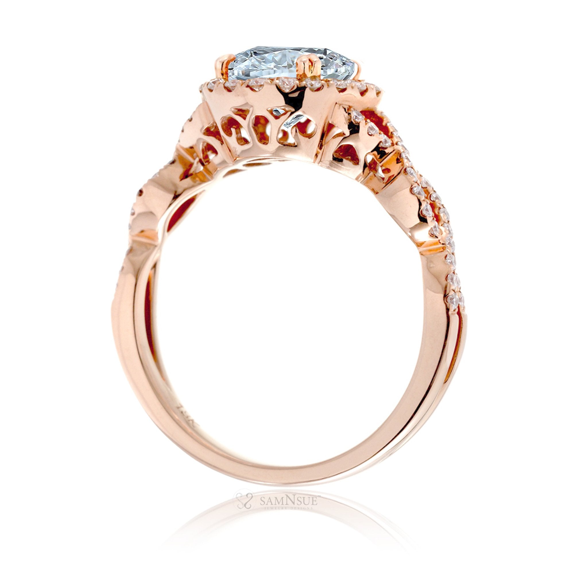 Oval cut aquamarine with diamond halo and twisted band rose gold