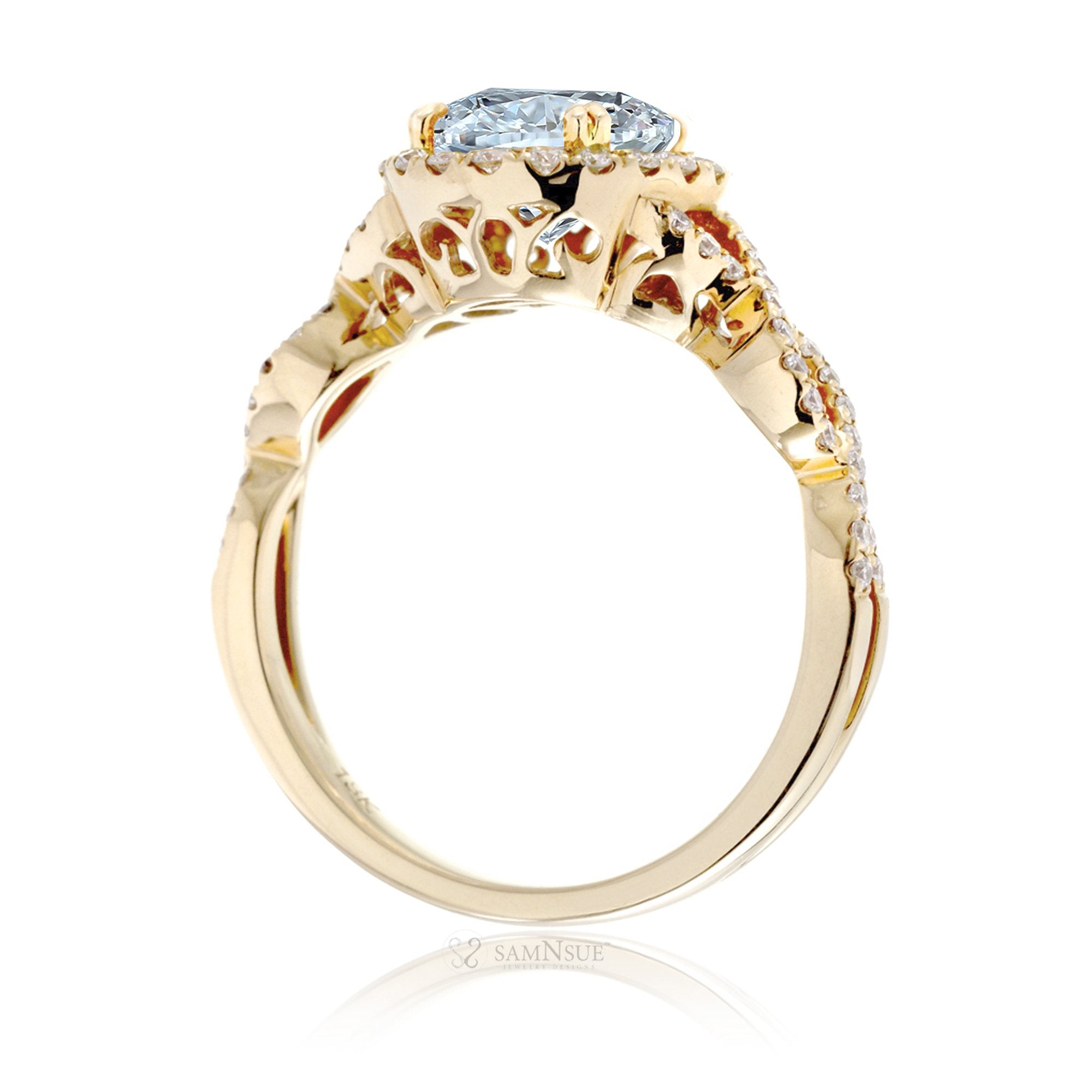 Oval cut aquamarine with diamond halo and twisted band yellow gold