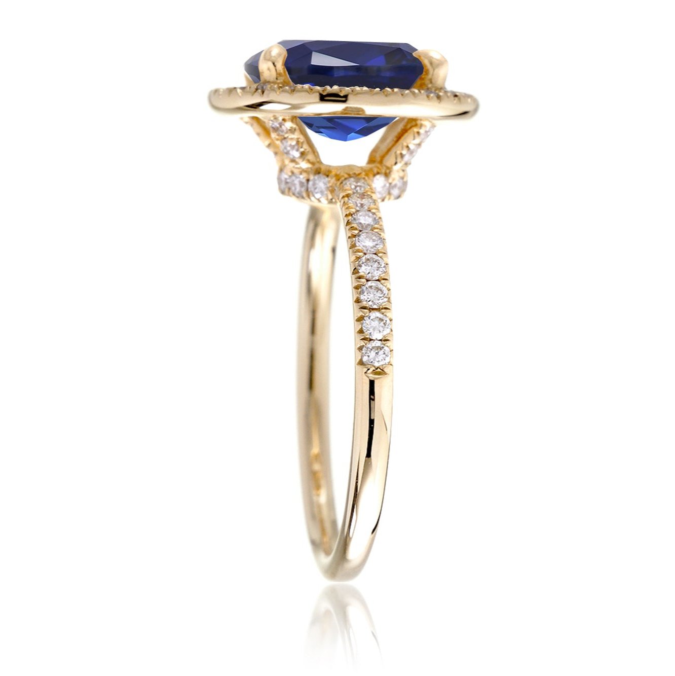 Oval sapphire diamond halo and band wedding rings yellow gold profile view