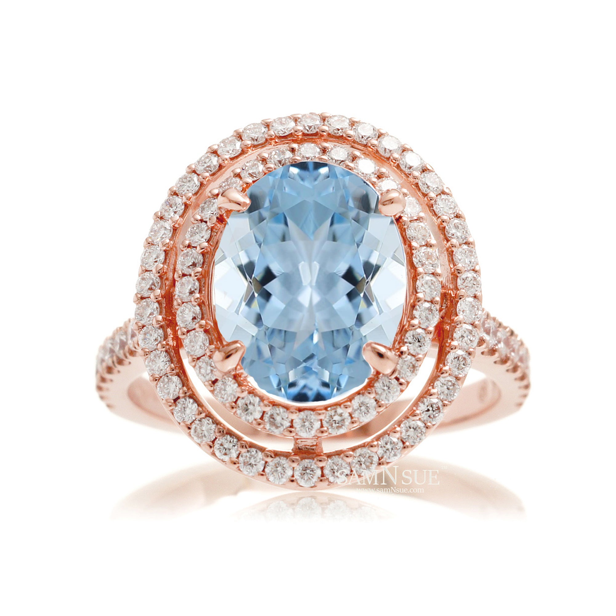Oval cut aquamarine ring with double halo diamond band in rose gold
