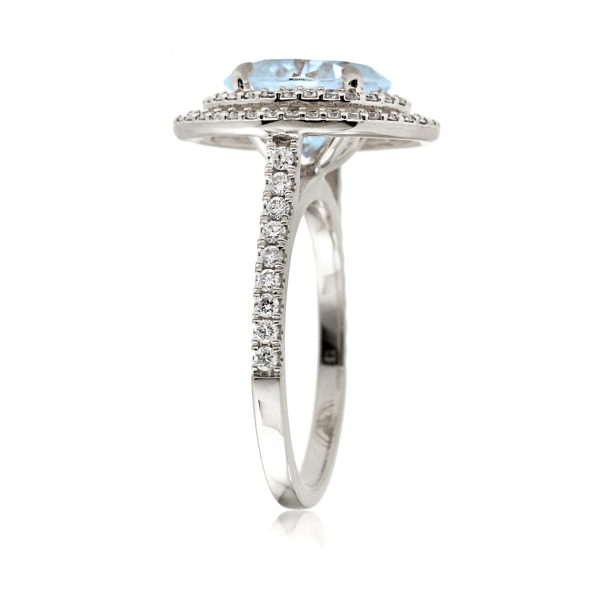Oval cut aquamarine ring with double halo diamond band in white gold