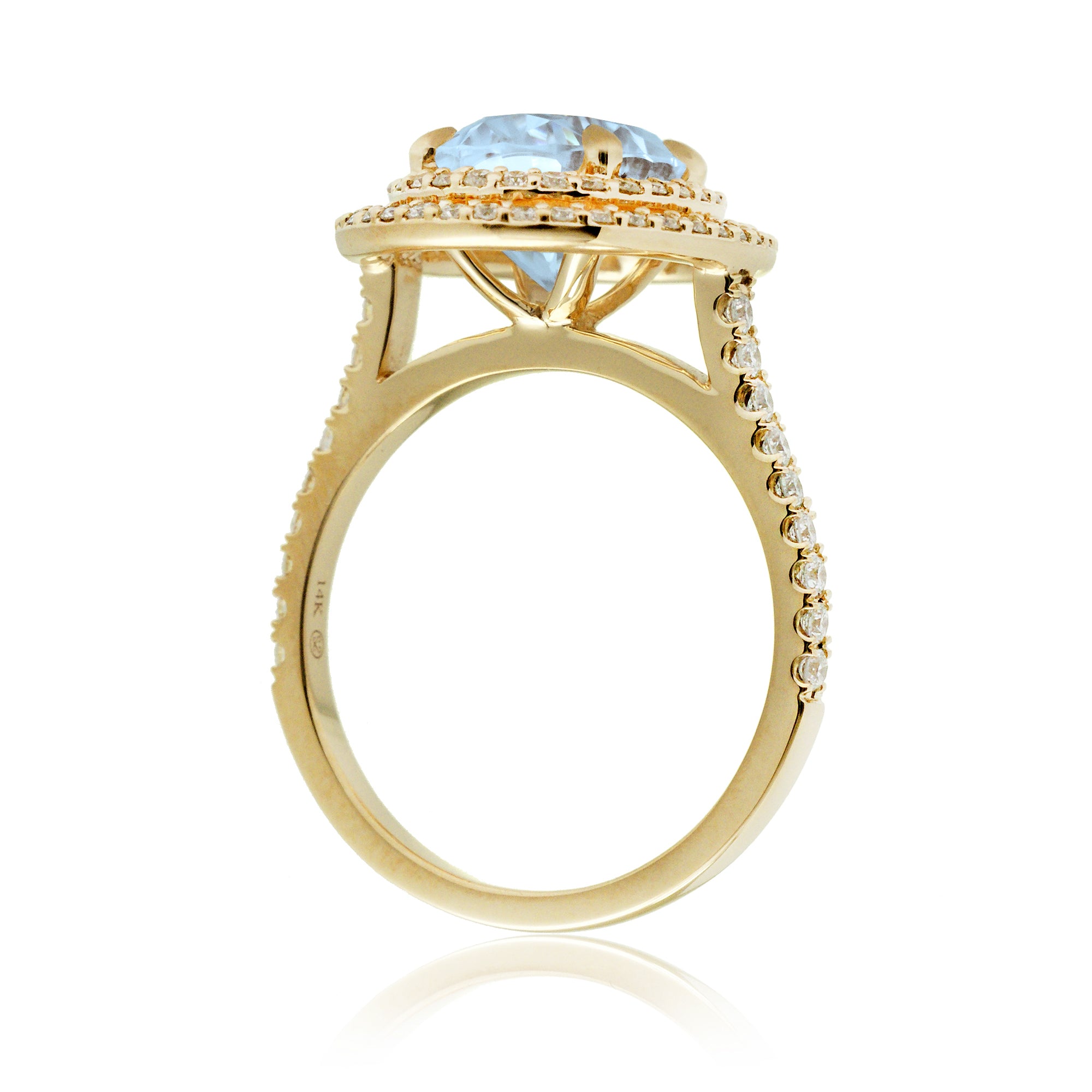 Oval cut aquamarine ring with double halo diamond band in yellow gold