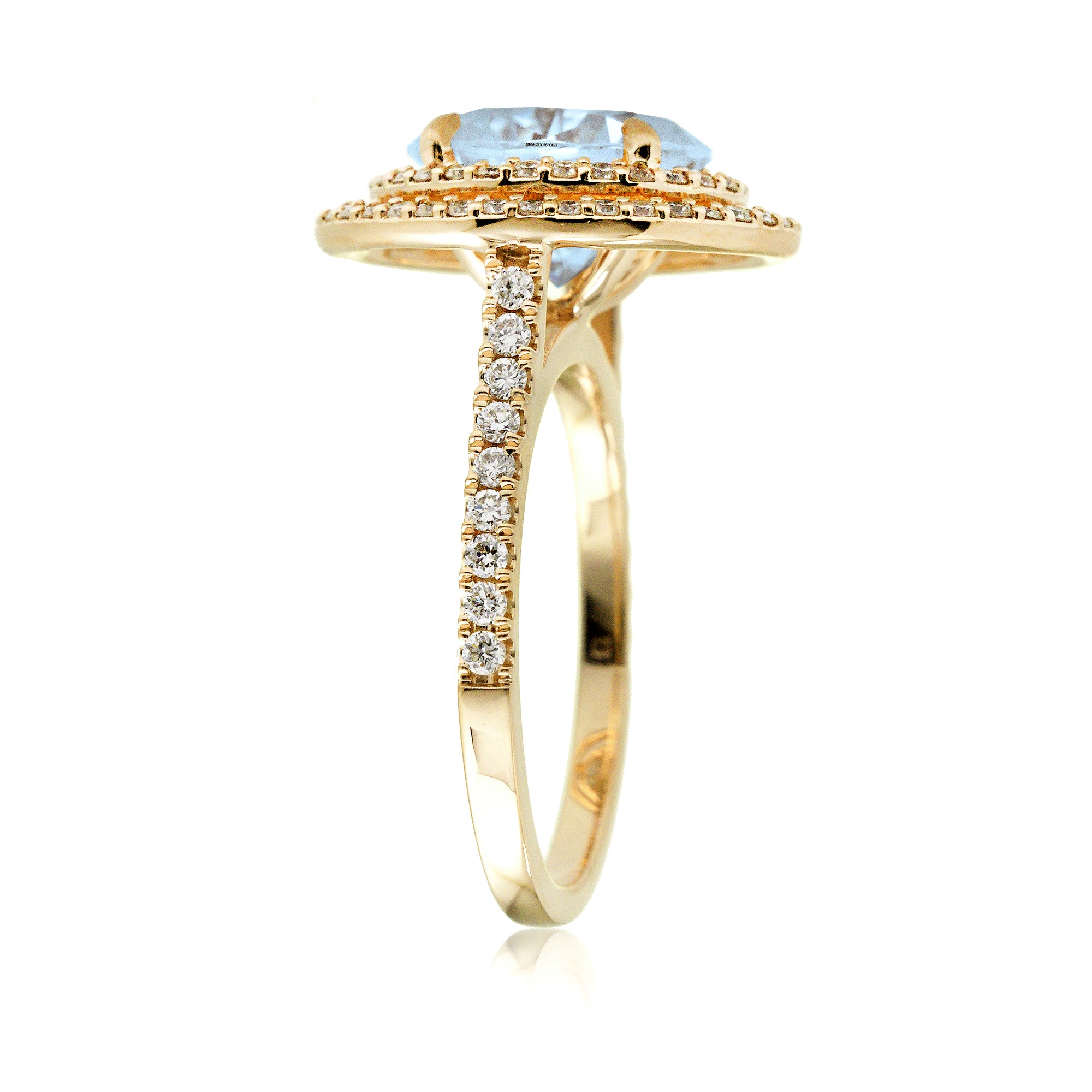 Oval cut aquamarine ring with double halo diamond band in yellow gold