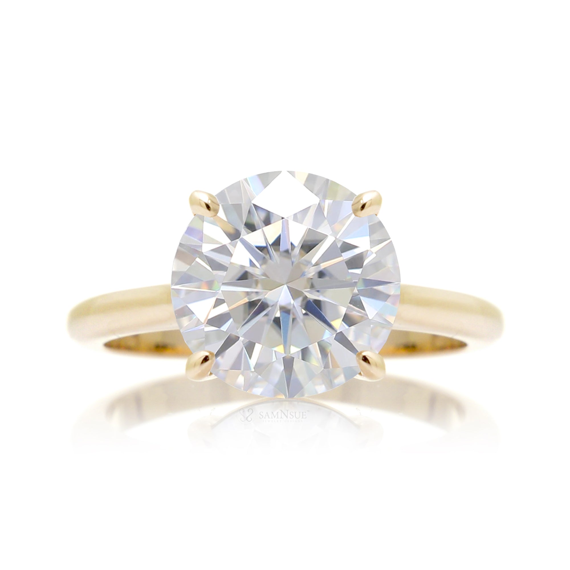 Round solitaire moissanite engagement ring in yellow gold