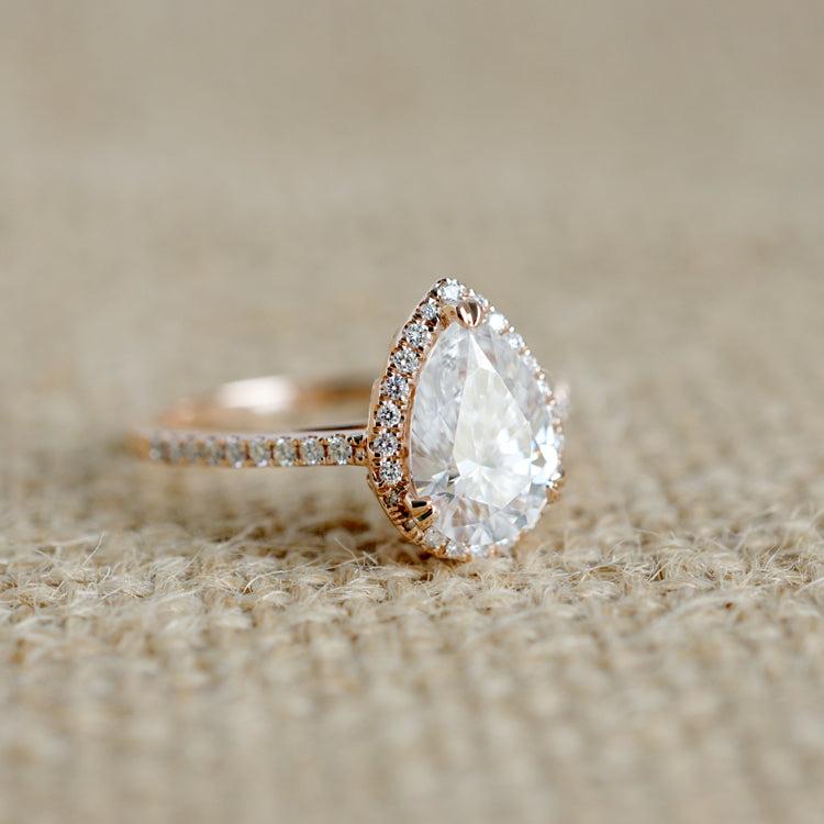 Pear diamond halo engagement ring in rose gold