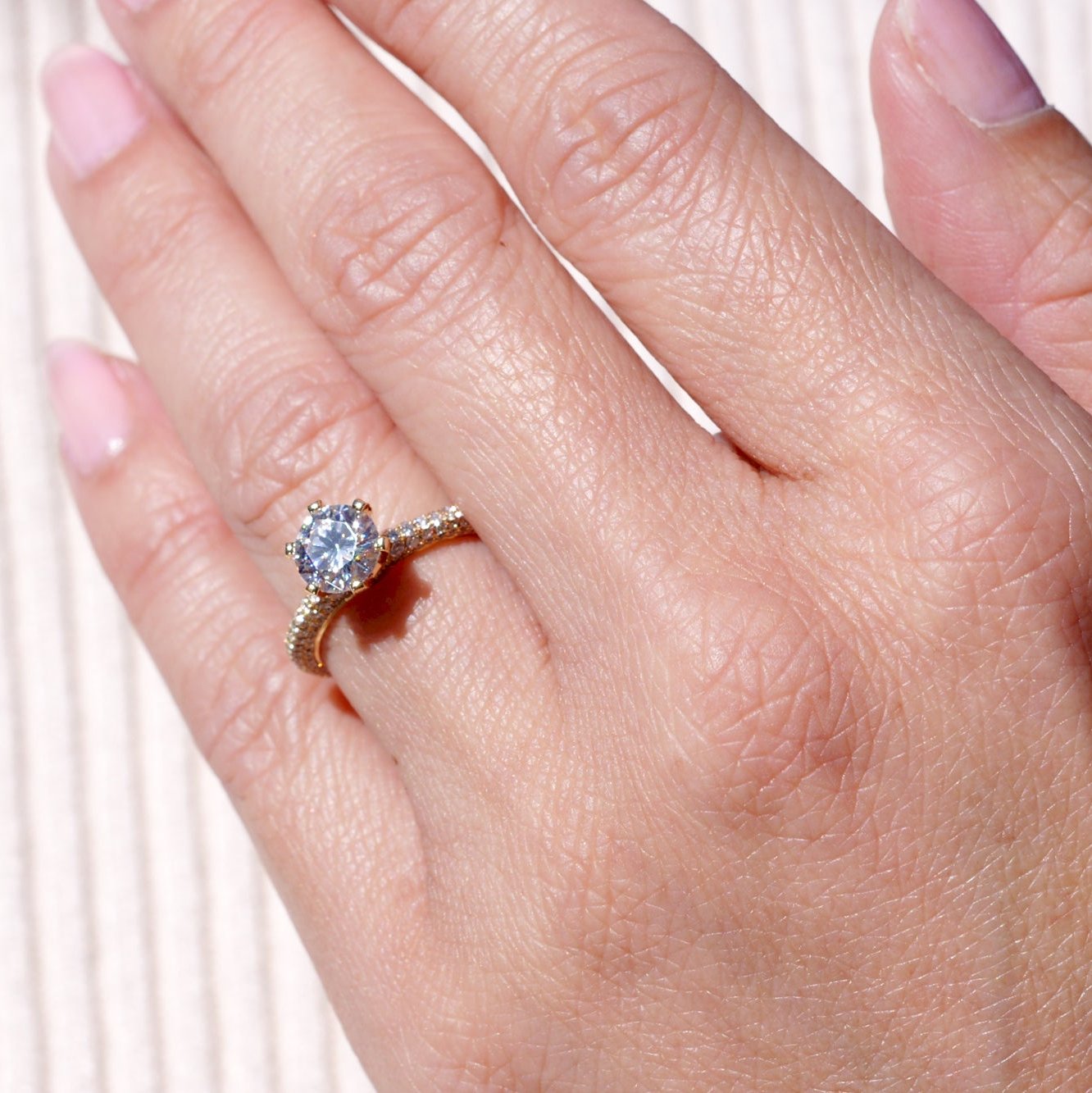 Pave diamond engagement ring with round center moissanite in rose gold