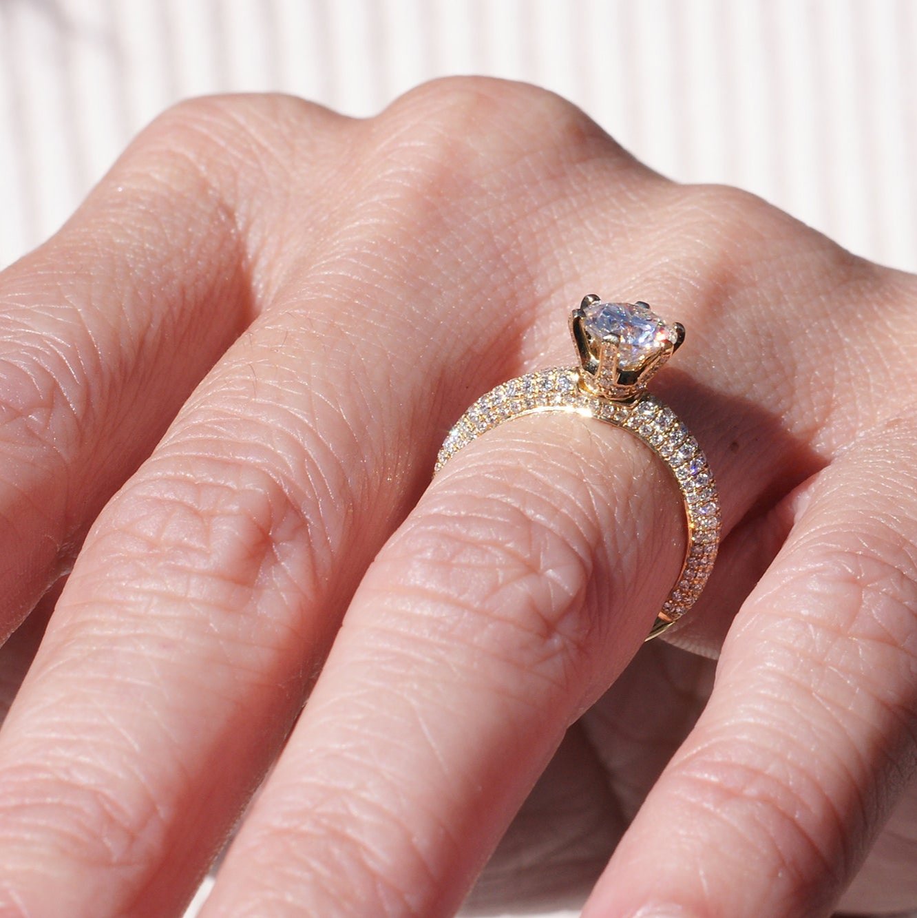 Pave diamond engagement ring with round center moissanite in rose gold