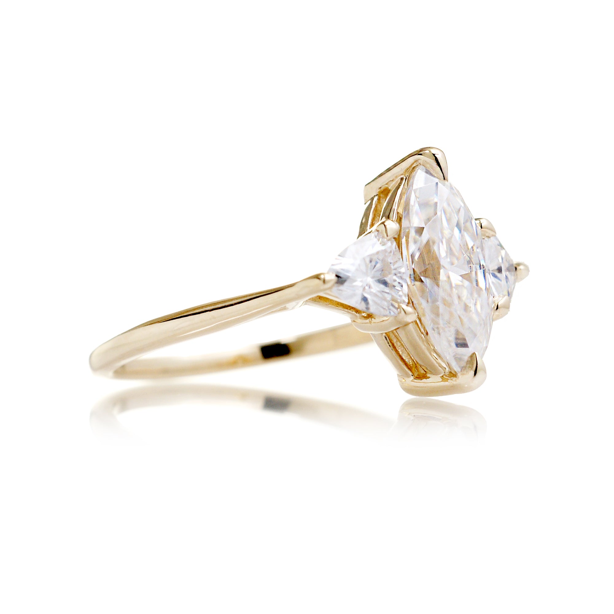 The Trillion Threestone Marquise Moissanite Ring